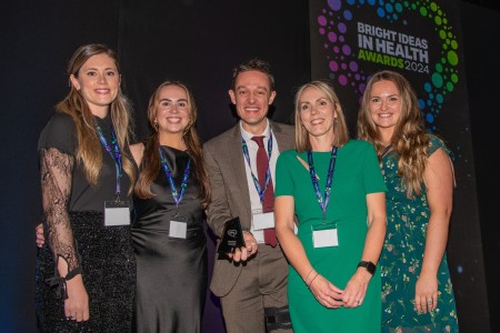 A picture of team members collecting an award at the event.