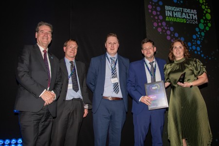 Some of the team collecting the award at the ceremony.