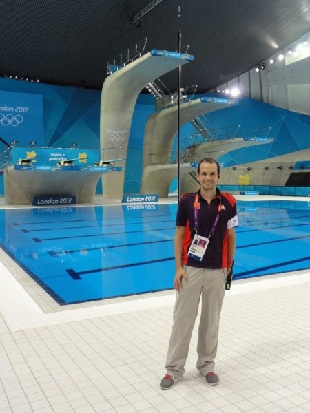 Man standing beside Olympic swimming pool at the London 2012 olympics