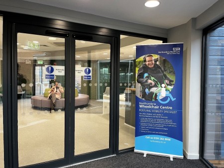 Pop-up banner for the wheelchair centre outside of the entrance.